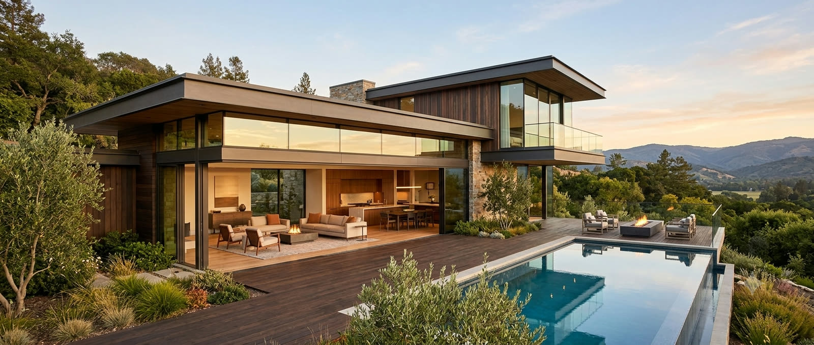 Modern contemporary home at dusk, deep eaves over glass and a pool deck